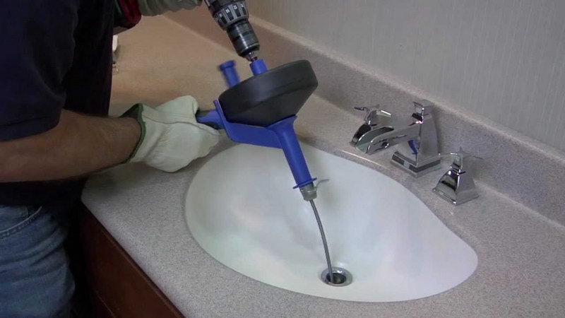unclogging kitchen sink drain snake